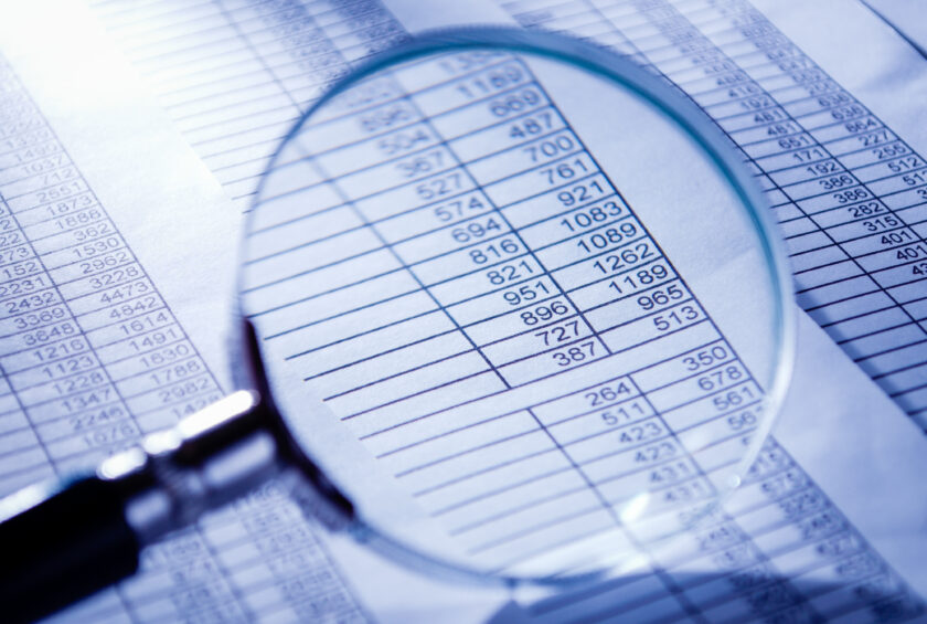 Conceptual Magnifying Glass on Invoice Reports